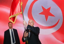 Kais Saied raises the country's flag