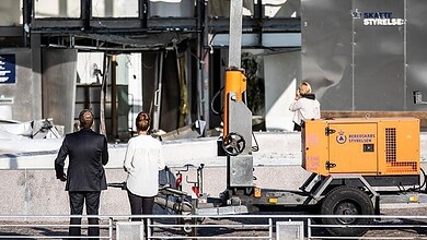 Scene of the second blast in Copenhagen, Denmark, with emergency response vehicles present.