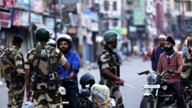 Security personnel and civilians interact during tense situation in Kashmir.
