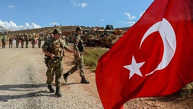 Turkish soldiers patrolling in Syria amid new military deployment restrictions and political efforts.