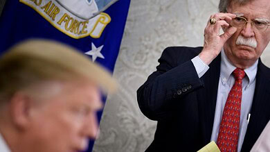 Donald Trump dismisses John Bolton, U.S. National Security Advisor, in a formal setting.