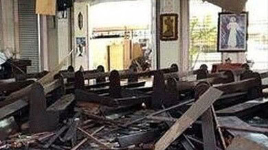 Damaged church interior with debris after terrorist attack in Burkina Faso.