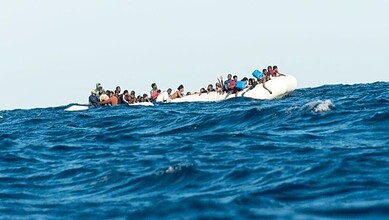 Shipwreck in Italy with migrants on a boat in the sea.