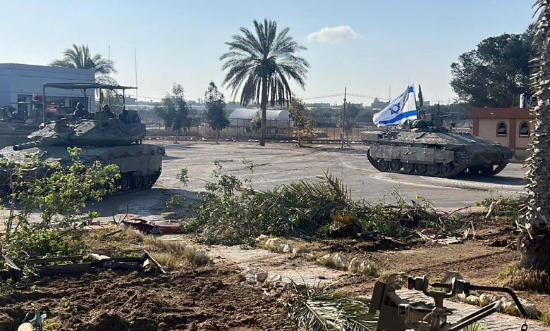 Israeli army tanks inside the Palestinian side of the Rafah border crossing in southern Gaza between the Strip and Egypt May 7, 2024