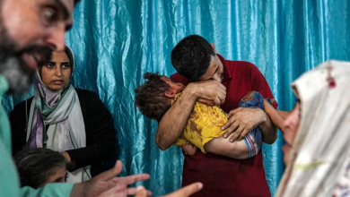 A man embraces a child injured as a result of the Israeli bombing in Deir al-Balah in the central Gaza Strip. June 4, 2024