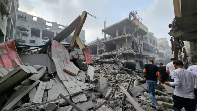 Palestinians gather at the site of Israeli strikes on houses, as the conflict between Israel and Palestinian Islamist group Hamas continues, in the northern Gaza Strip October 23, 2023.