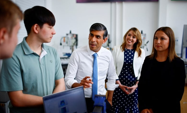 Conservative Party Leader Rishi Sunak speaks with students during a visit of University Technical College (UTC) in Silverstone, England, on Tuesday