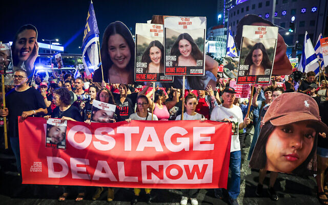 Demonstrators call for the release of hostages held in the Gaza Strip outside the Kirya military base in Tel Aviv, June 5, 2024