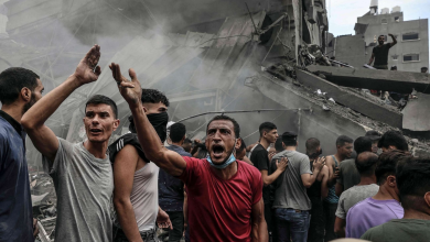 Palestinians search for survivors after an Israeli airstrike on buildings in the refugee camp of Jabalia in the Gaza Strip, Oct. 9, 2023.