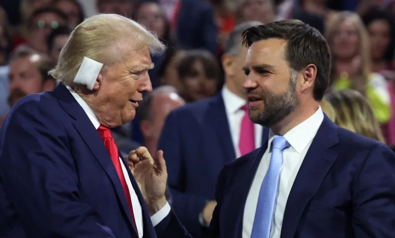 Republican presidential candidate Donald Trump shakes hands with Republican vice presidential candidate J.D. Vance during the first day of the Republican National Convention in Milwaukee. July 15, 2024