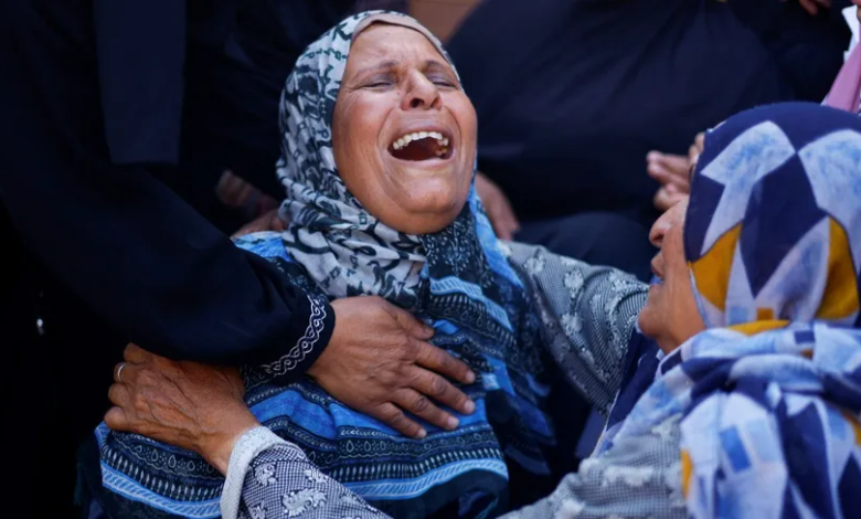 A Palestinian woman cries at Nasser Hospital after Israeli airstrikes killed her relatives in Khan Younis, southern Gaza Strip, August 13, 2024