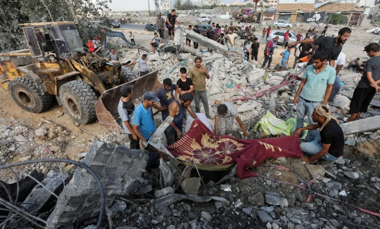 Palestinians search for survivors or injured people amid the rubble following Israeli shelling in central Gaza, August 17, 2024.