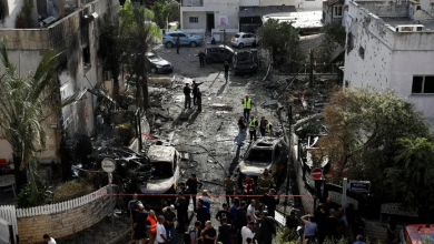 Emergency personnel at a damaged site following a Hezbollah rocket attack, near northern Haifa, Israel, September 22, 2024.