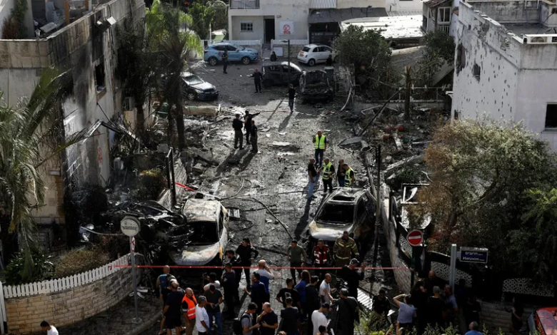 Emergency personnel at a damaged site following a Hezbollah rocket attack, near northern Haifa, Israel, September 22, 2024.