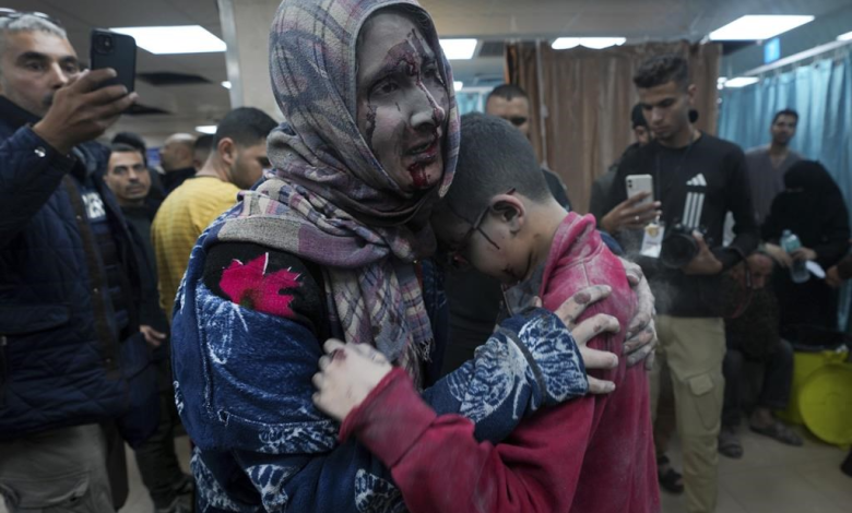 Palestinians wounded in the Israeli bombardment of the Gaza Strip are brought to the hospital in Deir al Balah on Friday, Dec. 8, 2023