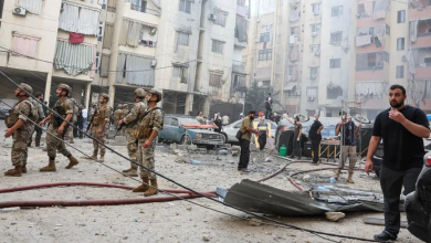 People and army personnel inspect the site of an airstrike in the southern suburbs of Beirut, Lebanon, September 20, 2024