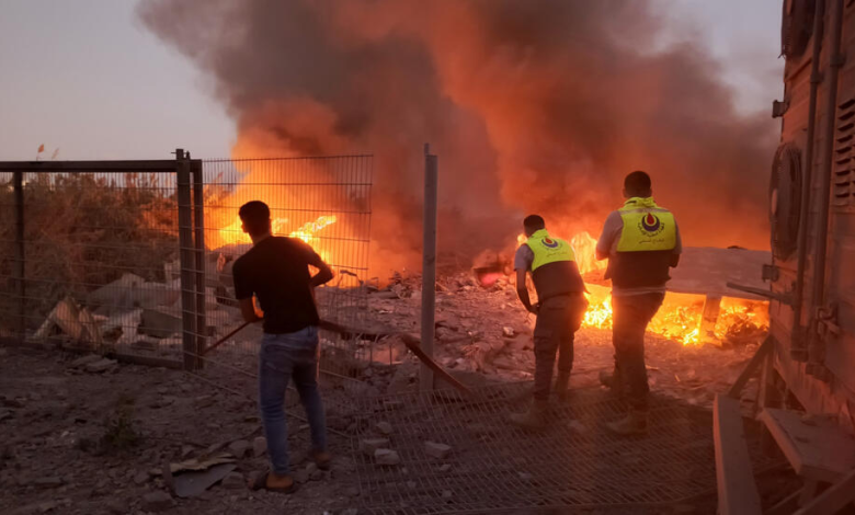 Rescuers rush to the scene of an Israeli airstrike that targeted the southern Lebanese village of Abbasiyeh on September 24, 2024