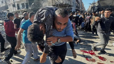 Palestinians try to help retrieve the wounded and bodies of victims following an Israeli airstrike on Beit Lahia in the Gaza Strip, October 30, 2024.