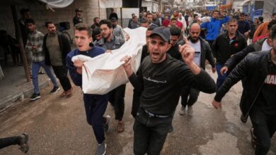 Palestinians carry for burial the bodies of Abdullah Habbash and six brothers from the Abu Mahadi family who were killed earlier in an Israeli army strike on the car they were traveling in, in Deir el-Balah, central Gaza Strip, on Sunday