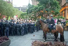 Police clash with protesters in Sydney over Israeli president's visit.
